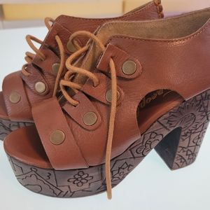 Free people carved wood clogs